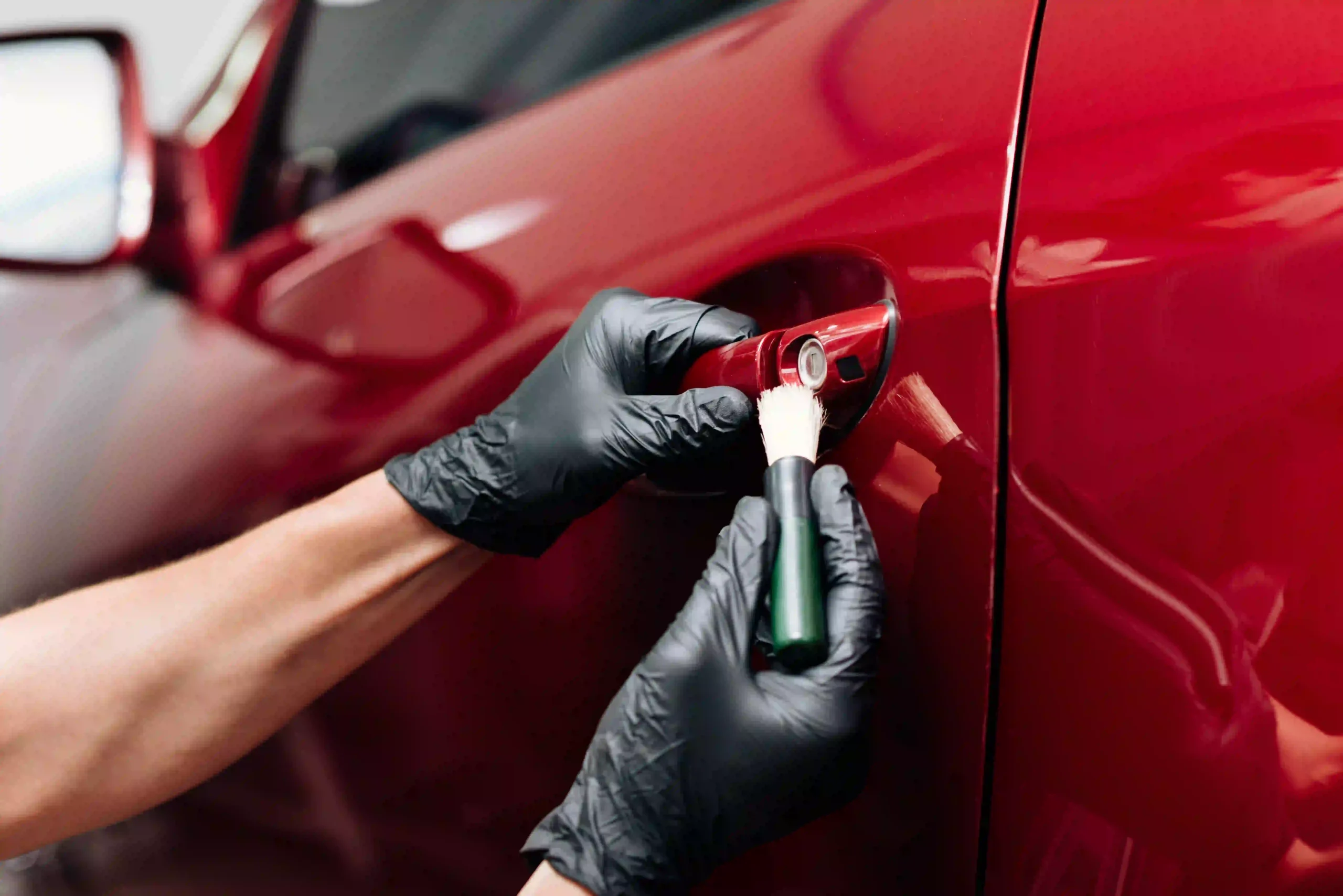 Automotive lockout service by Locksmith Kissimmee helping a driver regain access to their car.